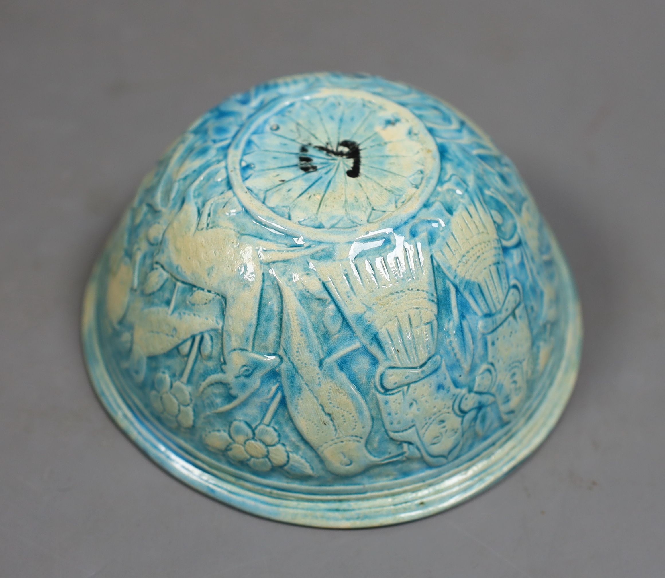 A Persian turquoise glazed fritware bowl, 12.5 cms diameter.